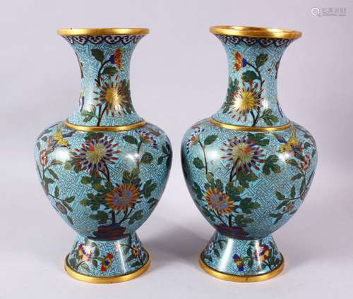 A PAIR OF CHINESE CLOISONNE BLUE GROUND VASES, each with a p...