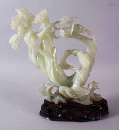 A CHINESE CARVED JADE FIGURE OF A GODDESS / GUANYIN, in an u...