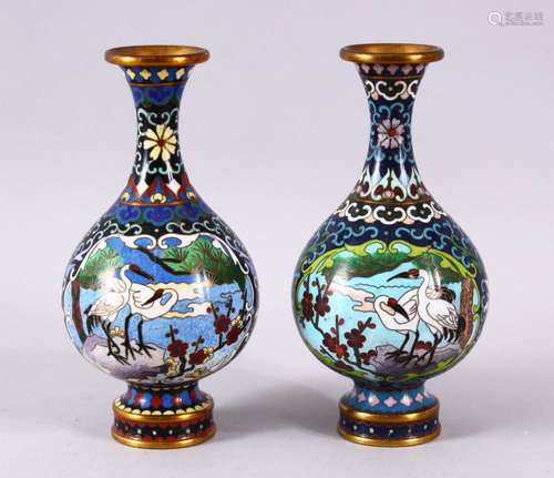 A PAIR OF CHINESE CLOISONNE CRANE VASES - each of the globul...