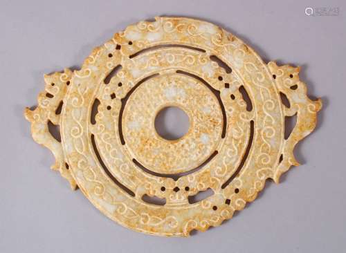 A CHINESE CARVED SOAPSTONE BI DISK, carved in archaic form w...