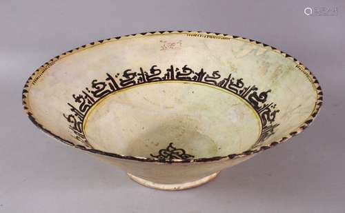 A LARGE NISHABOUR POTTERY BOWL, with banded script decoratio...