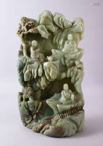 A LARGE AND HEAVY CHINESE CARVED JADE BOULDER - BUDDHA - the...