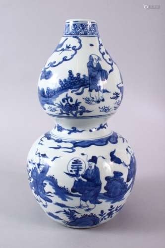 A CHINESE BLUE & WHITE DOUBLE GOURD PORCELAIN VASE, decorate...