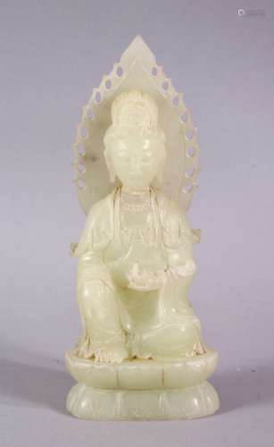 A CHINESE CARVED HARDSTONE FIGURE OF SEATED GUANYIN / DEITY,...