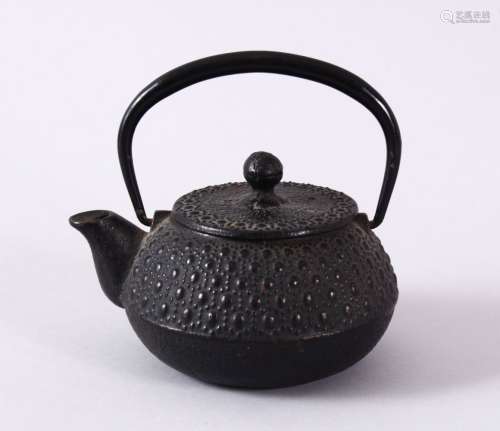 A JAPANESE IRON / METAL MOULDED TEAPOT & COVER, the body wit...