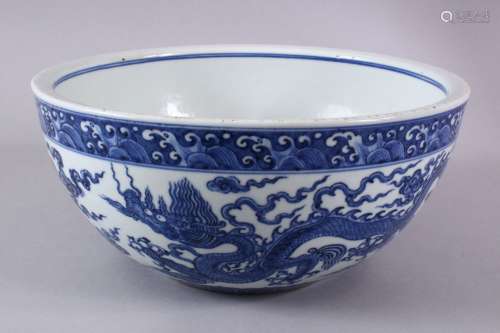 A CHINESE MING STYLE BLUE & WHITE PORCELAIN DRAGON BOWL - Th...