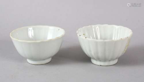 A SMALL PAIR OF CHINESE MONOCHROME WHITE PORCELAIN PETAL MOU...