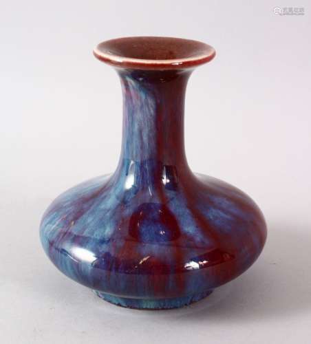 A CHINESE FLAMBE PORCELAIN VASE, with a graduated red - blue...