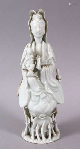 A CHINESE BLANC DE CHINE PORCELAIN FIGURE OF GUANYIN & CHILD...