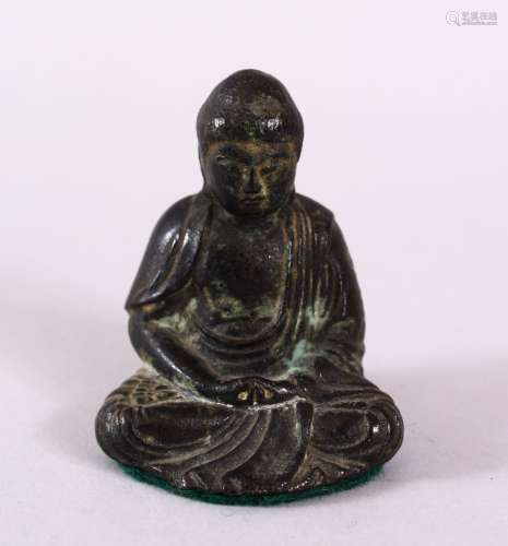 A CHINESE BRONZE FIGURE OF SEATED BUDDHA, seated with hands ...