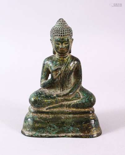 A CHINESE BRONZE FIGURE OF BUDDHA, in a seated position upon...