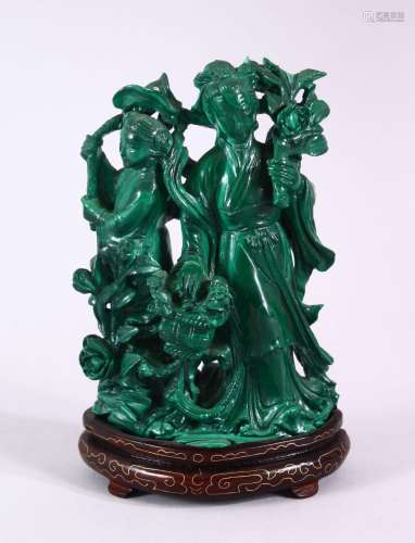 A CHINESE CARVED MALACHITE FIGURE OF TWO FEMALES, both carve...