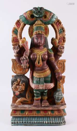 AN INDIAN CARVED WOOD & POLYCHOME FIGURE OF DURGA, depicted ...