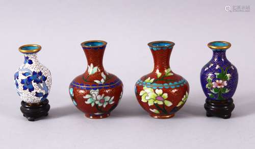 FOUR SMALL CHINESE CLOISONNE VASES - one pair with red groun...