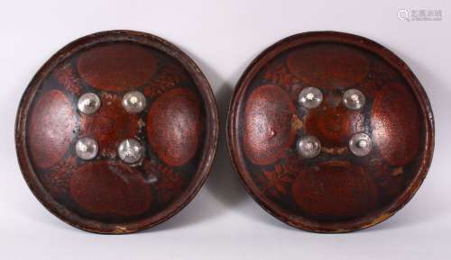 A GOOD PAIR OF INDIAN PAINTED AND LACQUERED LEATHER SHEILDS,...