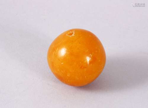 A GOOD & LARGE EGG YOLK AMBER CARVED BEAD, 4CM , 30GMS.