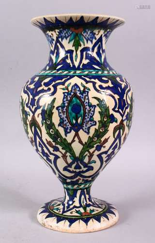 A TURKISH KUTAHIYA BALUSTER SHAPED VASE, painted in the Izni...