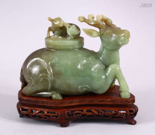 A CHINESE CARVED JADE DEER CENSER & COVER, The deer in a rec...