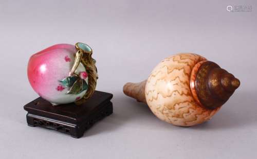 A SMALL PORCELAIN PEACH QUILL HOLDER and a porcelain shell.