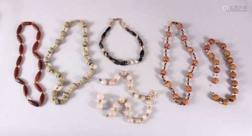 A MIXED LOT OF ISLAMIC / TURKISH CARVED STONE BEADS, varying...