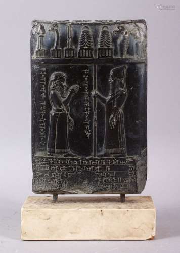 A MESOPOTAMIAN BABYLONIAN STYTLE CARVED BLACK TABLET, carved...