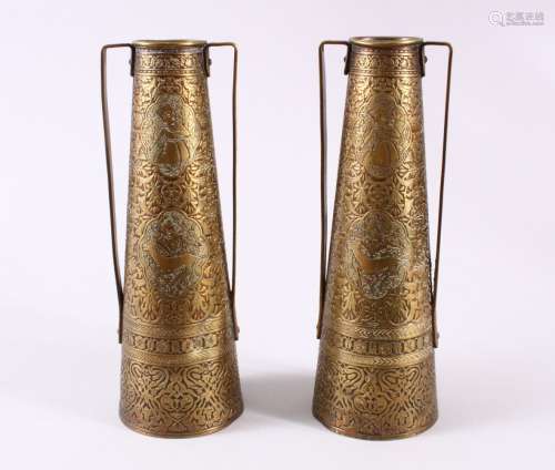 A PAIR OF PERSIAN BRASS ENGRAVED VASES, with twin handles, c...