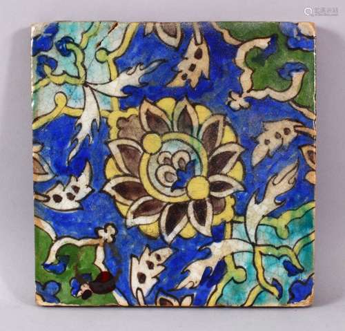 A SMALL SQUARE FORMED QAJAR POTTERY TILE SECTION, with under...