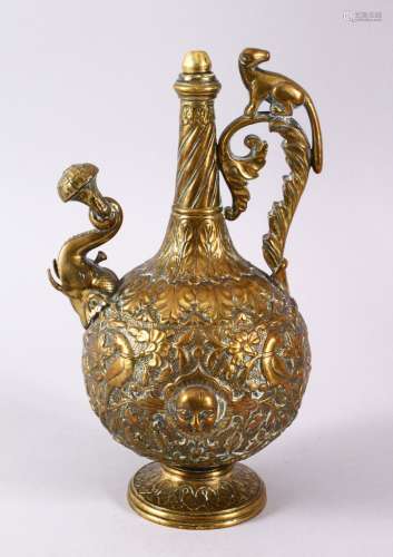 A 19TH CENTURY INDIAN SHIVA B RASS MOULDED EWER, with a stop...