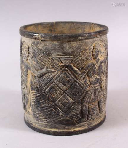 AN EASTERN? STONE CARVED FIGURAL BRUSH POT / VASE, carved wi...