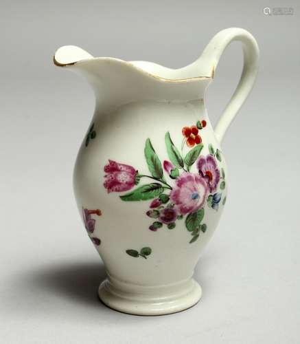 A WORCESTER FAMILLE ROSE JUG, painted with flowers. 3.5ins h...