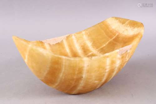 A CARVED MARBLE BOWL, with white inclusions among the yellow...