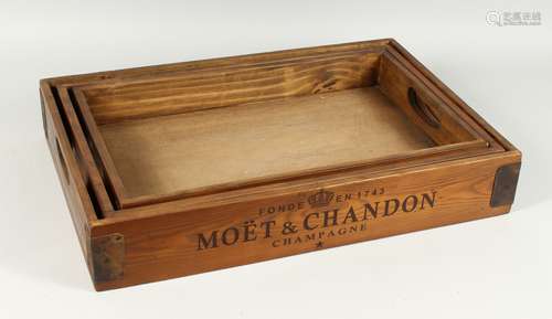 A GRADUATED SET OF THREE PINE TRAYS 'VEUVE CLICQUOT', larges...