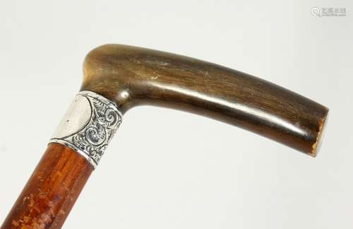 A VICTORIAN RHINO HANDLE AND TIP WALKING STICK with silver b...