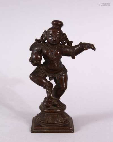 A FINE 17TH/18TH CENTURY INDIAN BRONZE FIGURE of baby Krishn...