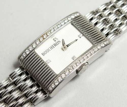 A GOOD DIAMOND SET BOUCHERON WATCH No. 090-3067 in original ...