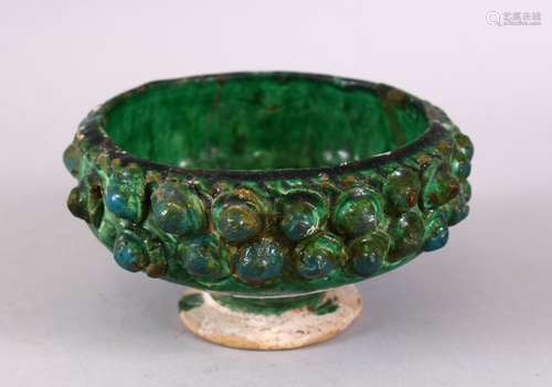 A GOOD KASHAN MOULDED GREEN GLAZED POTTERY BOWL, 14cm.