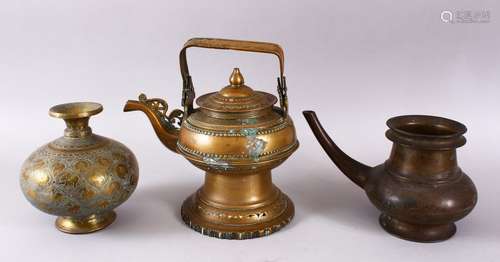 THREE INDIAN BRASS EWERS, various sizes.