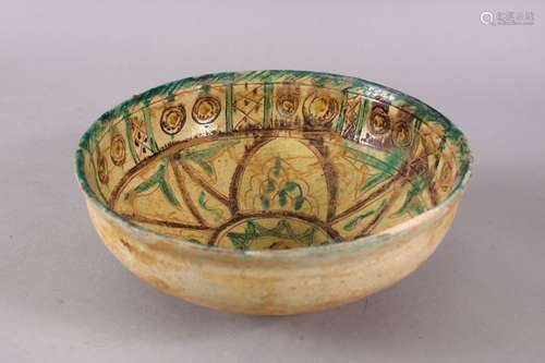 A GOOD IRAN STYLE POTTERY BOWL, decorated with green & biscu...