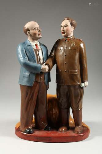 A RUSSIAN PORCELAIN GROUP OF LENIN AND A CHINESE GENERAL hol...