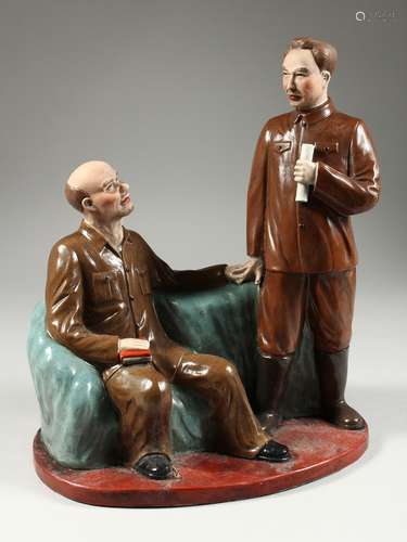 A RUSSIAN PORCELAIN GROUP OF LENIN AND a Chinese general hol...