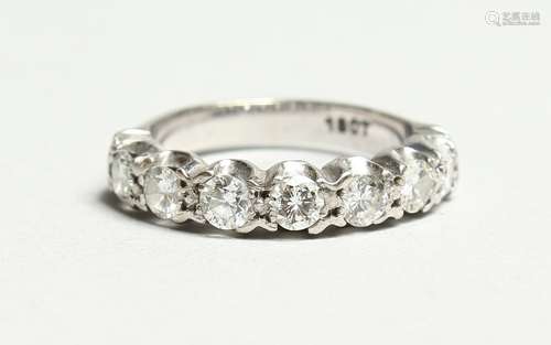 AN 18CT GOLD SIX STONE DIAMOND RING.