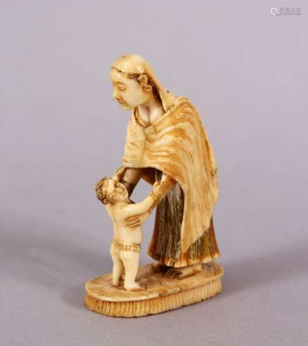 A RARE EARLY 19TH CENTURY INDIAN CARVED IVORY FIGURE of a Pa...