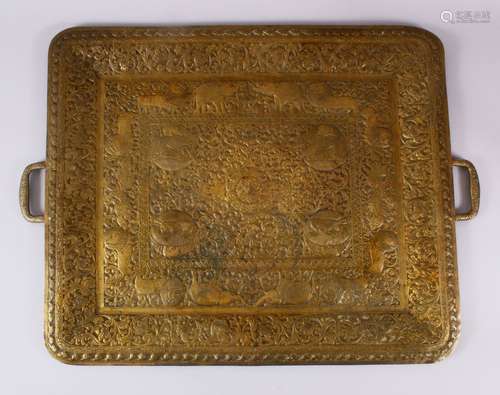 A LARGE 19TH CENTURY SRI LANKAN TWIN HANDLED BRASS TRAY, emb...