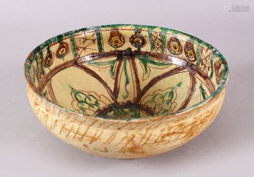 A GOOD IRAN STYLE POTTERY BOWL, decorated with green & biscu...