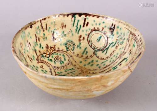 A GOOD IRAN STYLE POTTERY BOWL, decorated with green & biscu...