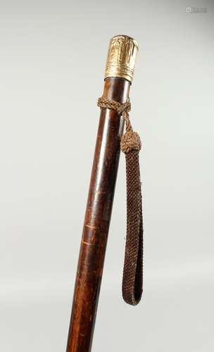 A LONG VICTORIAN TAPERING CEREMONIAL CANE with gilded handle...