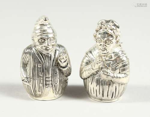 A PAIR OF .800 PUNCH AND JUDY SALT AND PEPPERS