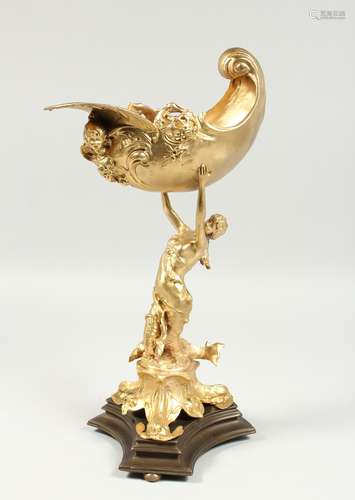 A GOOD GILT BRONZE SHELL held by a female classical figure o...