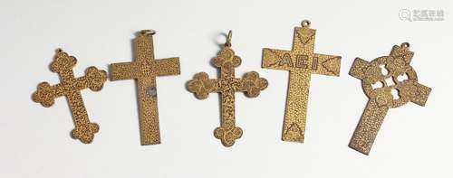 FIVE VARIOUS GILDED CROSSES, 2.25 to 3.5 inches long