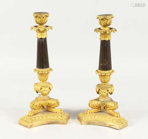 A SUPERB PAIR OF EMPIRE BRONZE AND GILT BRONZE CANDLESTICKS ...